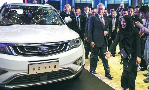 Chinese automaker Geely will inject cash and one SUV product for the 49.9 percent stake it has agreed to acquire in loss-making carmaker Proton to gain access to the booming Southeast Asian market. (Photo/Xinhua) Chinese automaker Geely will inject cash and one SUV product for the 49.9 percent stake it has agreed to acquire in loss-making carmaker Proton to gain access to the booming Southeast Asian market. (Photo/Xinhua)