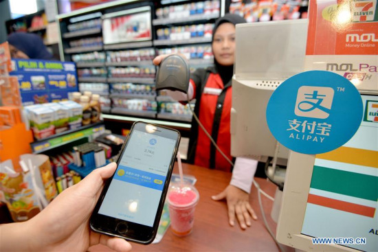 A customers uses Alipay to pay for his pill at a shop in Kuala Lumpur, Malaysia, July 24, 2017. Malaysia's second largest bank CIMB joined hands with Ant Financial, an affiliate company of Chinese e-commerce giant Alibaba, on Monday to cater to local mobile payment demands. (Xinhua/Chong Voon Chung) A customers uses Alipay to pay for his pill at a shop in Kuala Lumpur, Malaysia, July 24, 2017. Malaysia's second largest bank CIMB joined hands with Ant Financial, an affiliate company of Chinese e-commerce giant Alibaba, on Monday to cater to local mobile payment demands. (Xinhua/Chong Voon Chung)