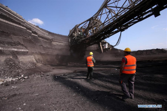 Employees work at Power Public Corporation's South Field lignite mine which is adjacent to Aghios Dimitrios power station at the outskirts of Kozani, Greece, June 6, 2017. (Xinhua/Marios Lolos) Employees work at Power Public Corporation's South Field lignite mine which is adjacent to Aghios Dimitrios power station at the outskirts of Kozani, Greece, June 6, 2017. (Xinhua/Marios Lolos)