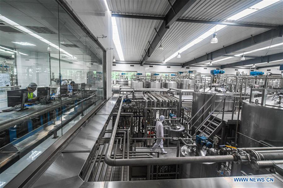 A worker checks a production line of dairy products at a company in Pingyang County of Wenzhou City, east China's Zhejiang Province, June 22, 2017. China's gross domestic product expanded 6.9 percent year on year in the first half of the year to about 38.15 trillion yuan (5.62 trillion U.S. dollars), data from the National Bureau of Statistics (NBS) showed Monday. (Xinhua/Xu Yu) A worker checks a production line of dairy products at a company in Pingyang County of Wenzhou City, east China's Zhejiang Province, June 22, 2017. China's gross domestic product expanded 6.9 percent year on year in the first half of the year to about 38.15 trillion yuan (5.62 trillion U.S. dollars), data from the National Bureau of Statistics (NBS) showed Monday. (Xinhua/Xu Yu)