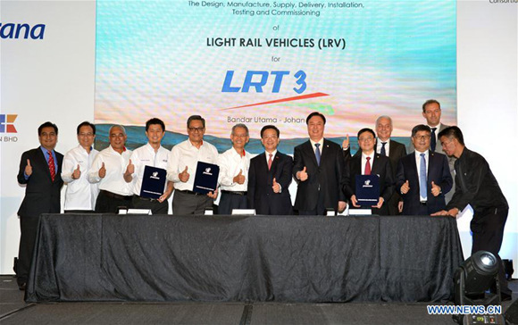 Guests pose for photos after the agreement signing ceremony held in Kuala Lumpur, Malaysia, on Aug. 2, 2017. Prasarana Malaysia, a public transport infrastructure company, signed an agreement with a consortium led by China's rolling stock manufacturer CRRC on Wednesday to introduce autopilot trains to Malaysia's public transportation system. (Xinhua/Chong Voon Chung) Guests pose for photos after the agreement signing ceremony held in Kuala Lumpur, Malaysia, on Aug. 2, 2017. Prasarana Malaysia, a public transport infrastructure company, signed an agreement with a consortium led by China's rolling stock manufacturer CRRC on Wednesday to introduce autopilot trains to Malaysia's public transportation system. (Xinhua/Chong Voon Chung)