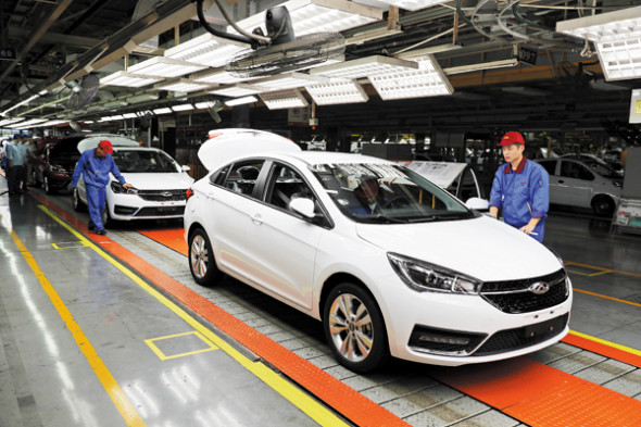 Workers check cars at Chinese automaker Chery's production line in Wuhu, Anhui province. Workers check cars at Chinese automaker Chery's production line in Wuhu, Anhui province.