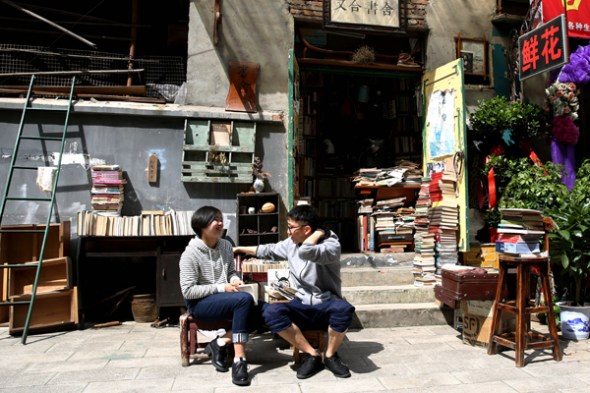 Literature enthusiasts chat outside the Youhe Bookstore. Literature enthusiasts chat outside the Youhe Bookstore.