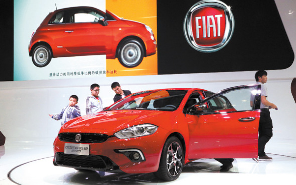 Visitors look at a Fiat model at a car expo in Zhengzhou, capital city of Henan province. Visitors look at a Fiat model at a car expo in Zhengzhou, capital city of Henan province.