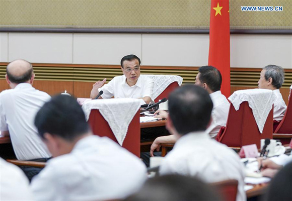 Chinese Premier Li Keqiang presides over a meeting with government officials and executives of leading manufacturers on manufacturing upgrades and economic restructuring in Beijing, capital of China, Aug. 25, 2017. (Xinhua/Xie Huanchi) Chinese Premier Li Keqiang presides over a meeting with government officials and executives of leading manufacturers on manufacturing upgrades and economic restructuring in Beijing, capital of China, Aug. 25, 2017. (Xinhua/Xie Huanchi)