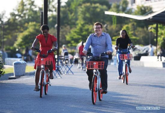 People ride bikes of Chinese bike-sharing giant Mobike in Washington D.C., the United States, Sept. 20, 2017. Chinese bike-sharing giant Mobike launched its service here on Wednesday, marking its U.S. debut amid a rapid global expansion. (Xinhua/Yin Bogu) People ride bikes of Chinese bike-sharing giant Mobike in Washington D.C., the United States, Sept. 20, 2017. Chinese bike-sharing giant Mobike launched its service here on Wednesday, marking its U.S. debut amid a rapid global expansion. (Xinhua/Yin Bogu)