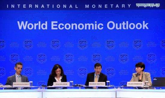 Maurice Obstfeld (2nd R), chief economist at the International Monetary Fund (IMF), attends a press briefing at the IMF headquarters in Washington D.C., the United States, on Oct. 10, 2017. The IMF on Tuesday raised its global growth forecast for 2017 and 2018 due to a broad-based recovery in Europe, China, Japan and the United States. (Xinhua/Yin Bogu) Maurice Obstfeld (2nd R), chief economist at the International Monetary Fund (IMF), attends a press briefing at the IMF headquarters in Washington D.C., the United States, on Oct. 10, 2017. The IMF on Tuesday raised its global growth forecast for 2017 and 2018 due to a broad-based recovery in Europe, China, Japan and the United States. (Xinhua/Yin Bogu)