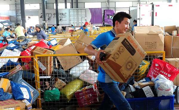 A Zhongtong Express employee sorts out packages at an outlet of the delivery firm in Fuyang, Anhui province. (Photo by Wang Biao/For China Daily) A Zhongtong Express employee sorts out packages at an outlet of the delivery firm in Fuyang, Anhui province. (Photo by Wang Biao/For China Daily)