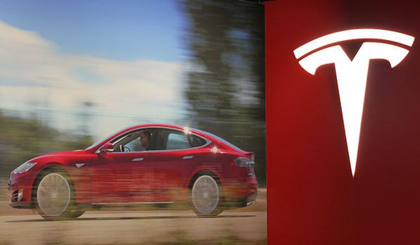 The Tesla logo is pictured on Feb 5, 2014 in its first Chinese mainland show room in Beijing. (Photo:chinadaily.com.cn/Hao Yan) The Tesla logo is pictured on Feb 5, 2014 in its first Chinese mainland show room in Beijing. (Photo:chinadaily.com.cn/Hao Yan)