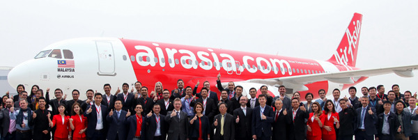 Officials from Airbus and Air Asia celebrate after the delivery ceremony for the A320neo aircraft in Tianjin on Wednesday.(Photo provided to China Daily) Officials from Airbus and Air Asia celebrate after the delivery ceremony for the A320neo aircraft in Tianjin on Wednesday.(Photo provided to China Daily)