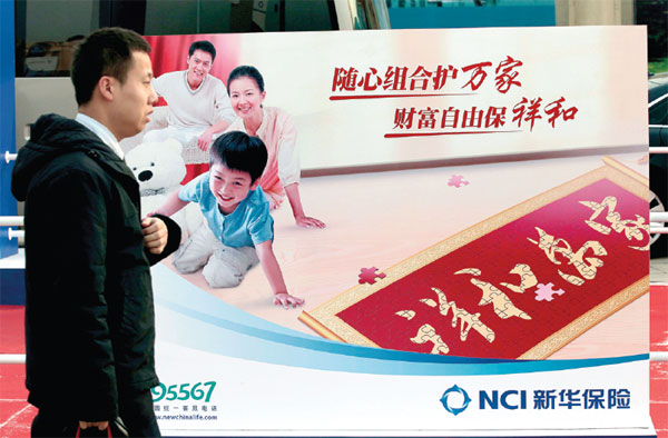A man passes by the billboard of New China Life Insurance Co at an insurance fair in Beijing. (Photo by A Qing/For China Daily) A man passes by the billboard of New China Life Insurance Co at an insurance fair in Beijing. (Photo by A Qing/For China Daily)
