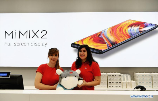 Staff members present a Xiaomi doll at a store in Madrid, capital of Spain, on Nov. 11, 2017. Xiaomi, one of the leading high-tech enterprises of China, opened on Saturday morning its two stores via its authorized re-sellers in Madrid. (Xinhua/Guo Qiuda) Staff members present a Xiaomi doll at a store in Madrid, capital of Spain, on Nov. 11, 2017. Xiaomi, one of the leading high-tech enterprises of China, opened on Saturday morning its two stores via its authorized re-sellers in Madrid. (Xinhua/Guo Qiuda)