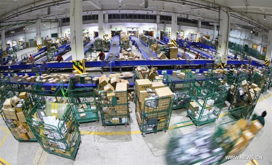 Employees work at a distribution center of Express Mail Service in Hengyang City, central China's Hunan province, Nov. 12, 2017. (Xinhua/Cao Zhengping) Employees work at a distribution center of Express Mail Service in Hengyang City, central China's Hunan province, Nov. 12, 2017. (Xinhua/Cao Zhengping)