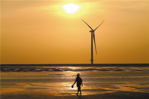 Carbon-trading system key to shifting nation's energy focus A wind farm at Rudong in Jiangsu province. Photo by Xu Congjun / for China Daily