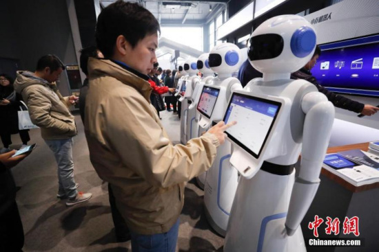 A visitor interacts with an intelligent robot at the Light of Internet Exposition of the fourth World Internet Conference in Wuzhen, Tongxiang City of east China's Zhejiang Province, Dec. 4, 2017. (Photo: China News Service/Du Yang) A visitor interacts with an intelligent robot at the Light of Internet Exposition of the fourth World Internet Conference in Wuzhen, Tongxiang City of east China's Zhejiang Province, Dec. 4, 2017. (Photo: China News Service/Du Yang)