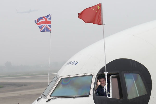 A British Airways captain poses for photographs on a panda-themed airplane at the Chengdu Shuangliu International Airport in Sichuan province. (Photo by Xie Minggang/For China Daily) A British Airways captain poses for photographs on a panda-themed airplane at the Chengdu Shuangliu International Airport in Sichuan province. (Photo by Xie Minggang/For China Daily)