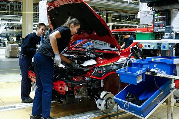 Workers assemble a car at AB Volvo's factory in Belgium.(Photo/Xinhua) Workers assemble a car at AB Volvo's factory in Belgium.(Photo/Xinhua)