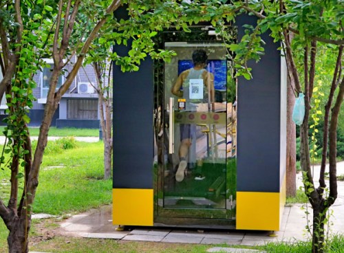A man exercises in a compact Misspao gym booth in a residential community in Beijing. (Photo/China Daily) A man exercises in a compact Misspao gym booth in a residential community in Beijing. (Photo/China Daily)