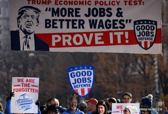 File photo taken on Dec. 7, 2016 shows people attending a rally calling for more jobs and better wages which was promised by Donald J. Trump during his campaign, in Washington D.C., the United States. With the United States retreating to the stronghold of protectionism and nationalism, concerns about a trade war are rising around the globe. (Xinhua/Yin Bogu) File photo taken on Dec. 7, 2016 shows people attending a rally calling for more jobs and better wages which was promised by Donald J. Trump during his campaign, in Washington D.C., the United States. With the United States retreating to the stronghold of protectionism and nationalism, concerns about a trade war are rising around the globe. (Xinhua/Yin Bogu)