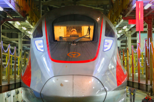 A Fuxing bullet train waits for maintenance in Beijing. (Photo by Jiang Dong/China Daily)