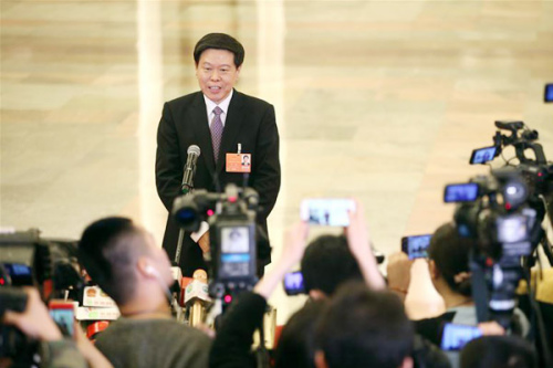 Director of China's State Administration of Taxation Wang Jun receives an interview after the fourth plenary meeting of the first session of the 13th National People's Congress at the Great Hall of the People in Beijing, March 13, 2018. (Photo/Xinhua) Director of China's State Administration of Taxation Wang Jun receives an interview after the fourth plenary meeting of the first session of the 13th National People's Congress at the Great Hall of the People in Beijing, March 13, 2018. (Photo/Xinhua)