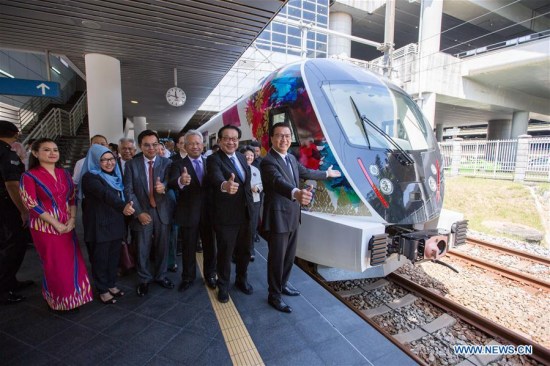 Malaysian Transport Minister Liow Tiong Lai (1st R) and guests pose for photos with the new KLIA Ekspres train at the Kuala Lumpur International Airport in Sepang, Malaysia, on March 13, 2018. (Xinhua/Zhu Wei) Malaysian Transport Minister Liow Tiong Lai (1st R) and guests pose for photos with the new KLIA Ekspres train at the Kuala Lumpur International Airport in Sepang, Malaysia, on March 13, 2018. (Xinhua/Zhu Wei)