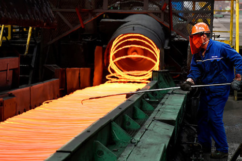 An employee checks steel rings at a steel plant in Zouping, Shandong Province. (Photo by Dong Naide/for China Daily) An employee checks steel rings at a steel plant in Zouping, Shandong Province. (Photo by Dong Naide/for China Daily)