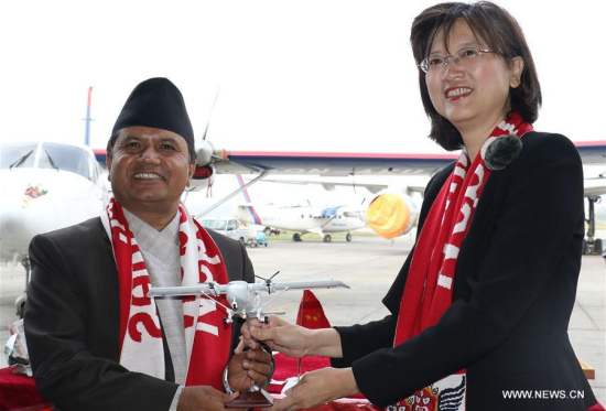 Nepalese Minister for Culture, Tourism and Civil Aviation Rabindra Prasad Adhikari (L) and Chinese Ambassador to Nepal Yu Hong attend the handover ceremony at the Tribhuvan International Airport in Kathmandu, Nepal. Nepal received two Y-12e planes as part of six-aircraft deal between Nepal and China. (Xinhua/Sunil Sharma) Nepalese Minister for Culture, Tourism and Civil Aviation Rabindra Prasad Adhikari (L) and Chinese Ambassador to Nepal Yu Hong attend the handover ceremony at the Tribhuvan International Airport in Kathmandu, Nepal. Nepal received two Y-12e planes as part of six-aircraft deal between Nepal and China. (Xinhua/Sunil Sharma)