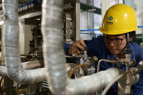 A technician of China Guodian Corp checks facilities in Lanzhou, capital of Gansu province. (Photo/Xinhua) A technician of China Guodian Corp checks facilities in Lanzhou, capital of Gansu province. (Photo/Xinhua)