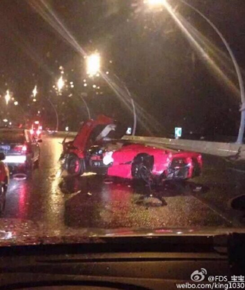 A red LaFerrari, worth 22-million yuan ($3.55 million), crashes in Shanghai amidst a rain burst on Tuesday night. (Photo/Xinmin.cn) A red LaFerrari, worth 22-million yuan ($3.55 million), crashes in Shanghai amidst a rain burst on Tuesday night. (Photo/Xinmin.cn)