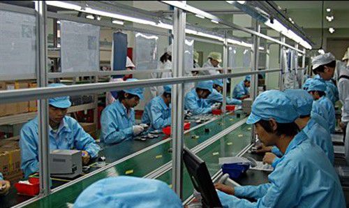Employees work at an OEM factory. (Photo/China Business News) Employees work at an OEM factory. (Photo/China Business News)