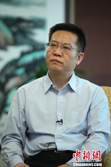 Li Beiguang, the deputy director of the Planning Department of the Ministry of Industry and Information Technology, speaks in an interview on May 19, 2015. (Photo/Chinanews.com) Li Beiguang, the deputy director of the Planning Department of the Ministry of Industry and Information Technology, speaks in an interview on May 19, 2015. (Photo/Chinanews.com)