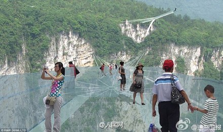 The world's longest and highest glass-bottomed bridge is to open in Zhangjiajie, Hunan province. (Photo/People's Daily Online) The world's longest and highest glass-bottomed bridge is to open in Zhangjiajie, Hunan province. (Photo/People's Daily Online)
