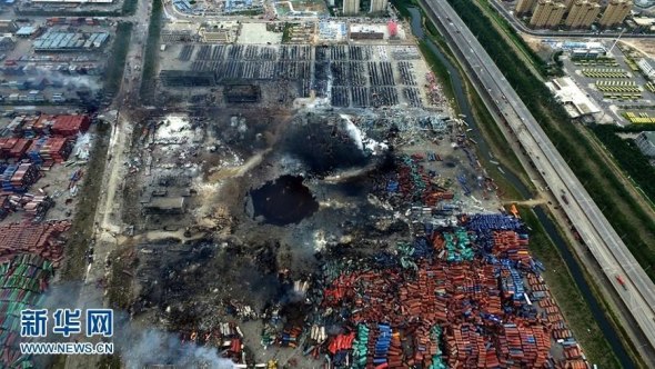 An aerial photograph taken on Aug 16, 2015 shows a huge hole at the center of the site of a series of explosions in North China’s Tianjin municipality. (Photo An aerial photograph taken on Aug 16, 2015 shows a huge hole at the center of the site of a series of explosions in North China’s Tianjin municipality. (Photo