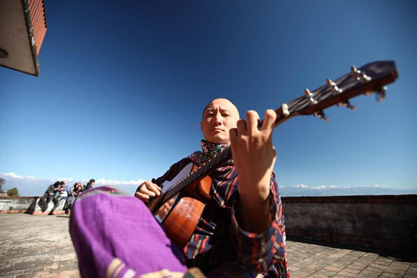 Liang plays music in Nepal in 2010. (Photo courtesy of Liang Xu) Liang plays music in Nepal in 2010. (Photo courtesy of Liang Xu)