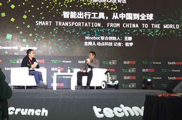 Ninebot co-founder Wang Ye (R) speaks at a Tech Crunch panel on smart transportation in Beijing, Nov. 2, 2015. (Photo provided to ECNS) Ninebot co-founder Wang Ye (R) speaks at a Tech Crunch panel on smart transportation in Beijing, Nov. 2, 2015. (Photo provided to ECNS)