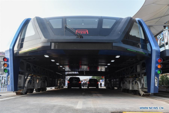 The transit elevated bus TEB-1 is on road test in Qinhuangdao, north China's Hebei Province, Aug. 2, 2016. China's home-made transit elevated bus, TEB-1, conducted a road test running Tuesday. (Xinhua/Luo Xiaoguang) The transit elevated bus TEB-1 is on road test in Qinhuangdao, north China's Hebei Province, Aug. 2, 2016. China's home-made transit elevated bus, TEB-1, conducted a road test running Tuesday. (Xinhua/Luo Xiaoguang)