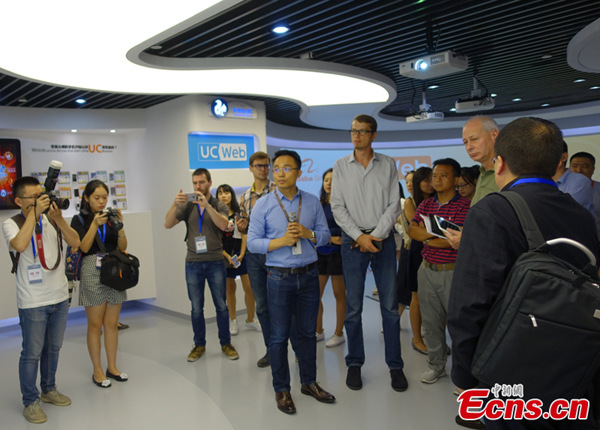 Media representatives attending the China-Russia Internet Media Forum listen to an introductory speech about UCWeb, a portfolio company of Alibaba Mobile Business Group, in Tianhe district, Guangzhou, South China’s Guangdong Province, Oct. 28, 2016. (Photo: Ecns.cn/Wang Fan) Media representatives attending the China-Russia Internet Media Forum listen to an introductory speech about UCWeb, a portfolio company of Alibaba Mobile Business Group, in Tianhe district, Guangzhou, South China’s Guangdong Province, Oct. 28, 2016. (Photo: Ecns.cn/Wang Fan)