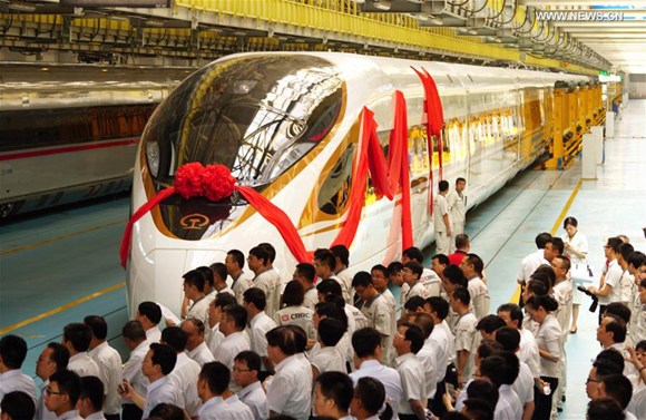 People attend a naming ceremony for the new models of China's electric multiple unit (EMU) train Fuxing in Beijing, capital of China, June 25, 2017. (Xinhua/Xing Guangli) People attend a naming ceremony for the new models of China's electric multiple unit (EMU) train Fuxing in Beijing, capital of China, June 25, 2017. (Xinhua/Xing Guangli)
