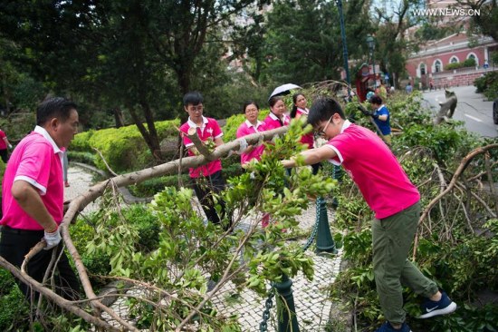 Volunteers of Women's General Association of Macao clean a road in Macao, south China, Aug. 24, 2017. Bringing heavy gusts and rainstorms, Hato destroyed more than 4,000 trees in Macao on Wednesday. (Xinhua) Volunteers of Women's General Association of Macao clean a road in Macao, south China, Aug. 24, 2017. Bringing heavy gusts and rainstorms, Hato destroyed more than 4,000 trees in Macao on Wednesday. (Xinhua)