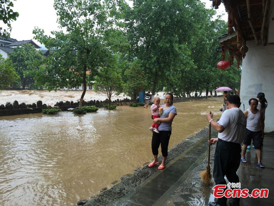 SW China county hit by downpours and floods(1/4)