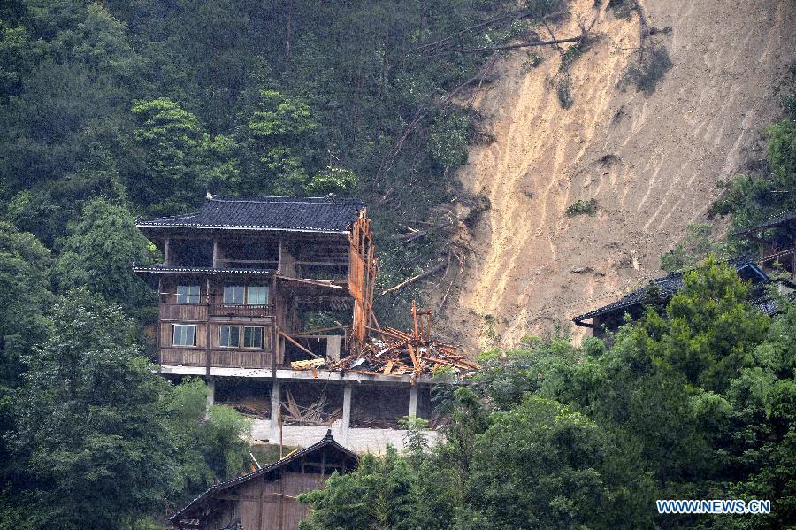Landslide takes place in SW China' village due to heavy rain(1/2)