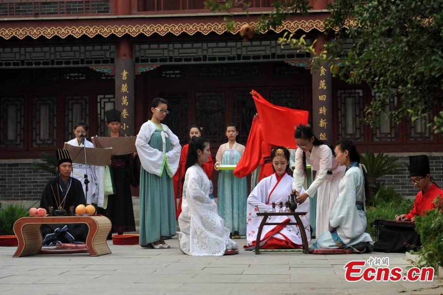 Music club members re-enact traditional coming-of-age ceremony (1/4)