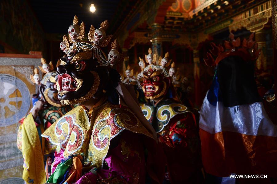 Monks wearing masks rehearse Gesar opera at Chalang Temple in NW China (1/8)
