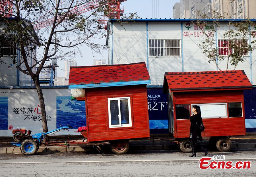 A “motorhome” converted from a tractor is seen on a street in Zhengzhou, Central China’s Henan province on October 26, 2015. The vehicle features two rooms with red walls and roofs was transformed by a local farmer. (Photo/CFP)
