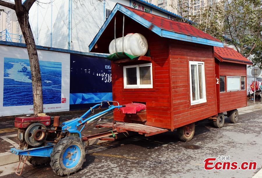 A “motorhome” converted from a tractor is seen on a street in Zhengzhou, Central China’s Henan province on October 26, 2015. The vehicle features two rooms with red walls and roofs was transformed by a local farmer. (Photo/CFP)