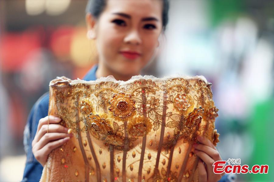 Gold wedding gown shown in C China (1/3)