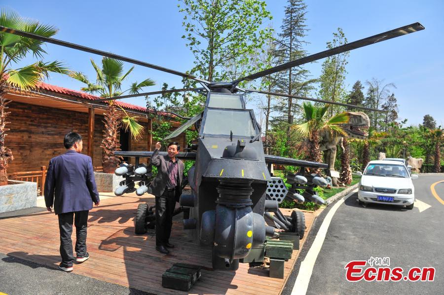 Restaurant fitted with scrap-turned military helicopter model (1/6)