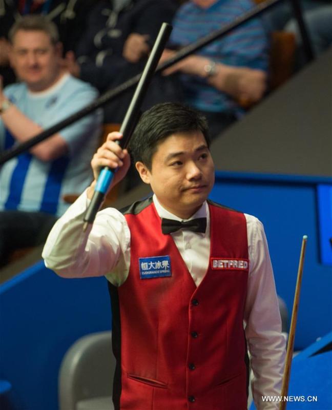 Ding Junhui of China celebrates after the second round match against Judd Trump of England at Snooker World Championship 2016 at the Crucible Theatre in Sheffield, England, on April 25, 2016. Ding won 13-10. (Xinhua/Jon Buckle)