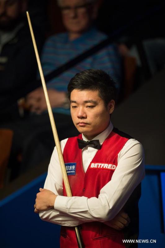 Ding Junhui of China reacts during the second round match against Judd Trump of England at Snooker World Championship 2016 at the Crucible Theatre in Sheffield, England, on April 25, 2016. Ding won 13-10. (Xinhua/Jon Buckle)